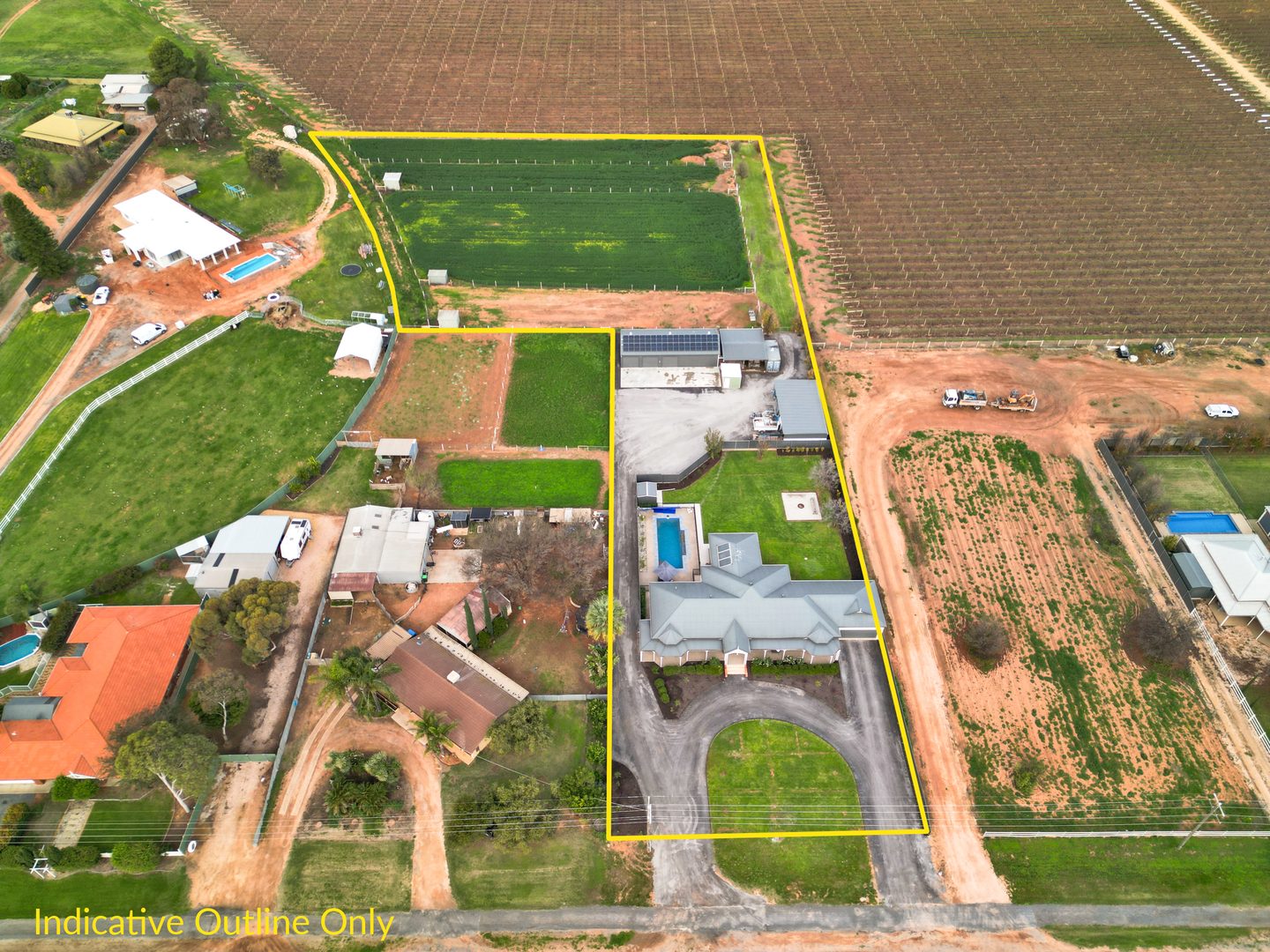 Aerial photograph showing the home, pool, shed and paddocks with an indicative property outline